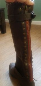 Knee high boots with red zipper